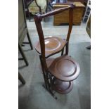 An Edward VII inlaid mahogany folding cake stand