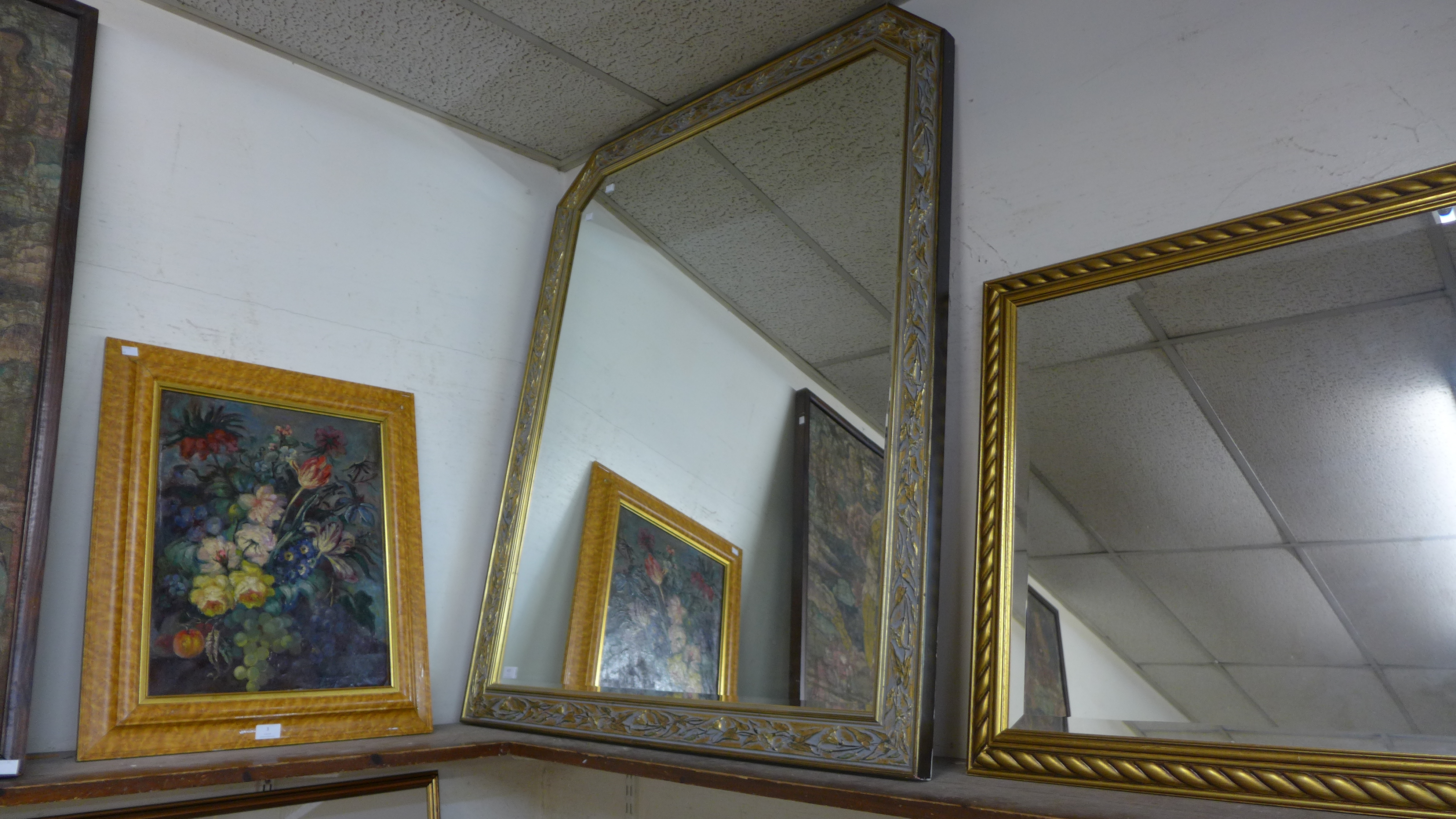 A large gilt framed mirror