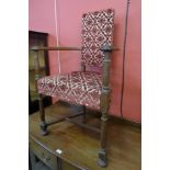 An Arts and Crafts George Walton style oak open armchair