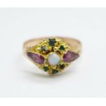 A Victorian yellow metal, opal, almandine garnet and green stone ring, tests as 9ct gold, 1.7g,