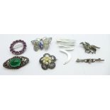 Six silver brooches including a silver and marcasite horse and jockey brooch, and one other brooch