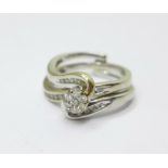 A 9ct white gold and diamond double interlocking ring, 0.35carat total diamond weight, 4.4g, K