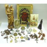 A collection of religious items including Rosary, medallions, figure, miniature travel figure,