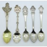 Three Rolex spoons, a silver spoon and one other spoon