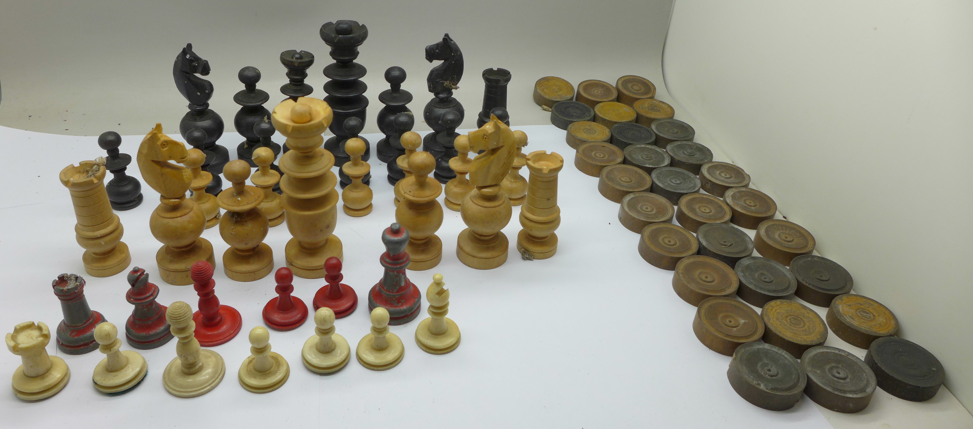 Chess and draughts pieces, incomplete sets