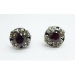 A pair of silver and garnet set Arts and Crafts earrings with screw backs, 13mm diameter