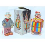 A plastic Battery Operated Walking Clown, made in Hong Kong, box lacking top, and a tin-plate and