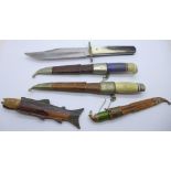 Three Finnish Puuko knives with scabbards, one other knife with fish handle and scabbard, the