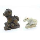 A signed Kirin netsuke and a carved lion, lion a/f