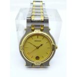 A yellow metal and stainless steel Gucci dress wristwatch
