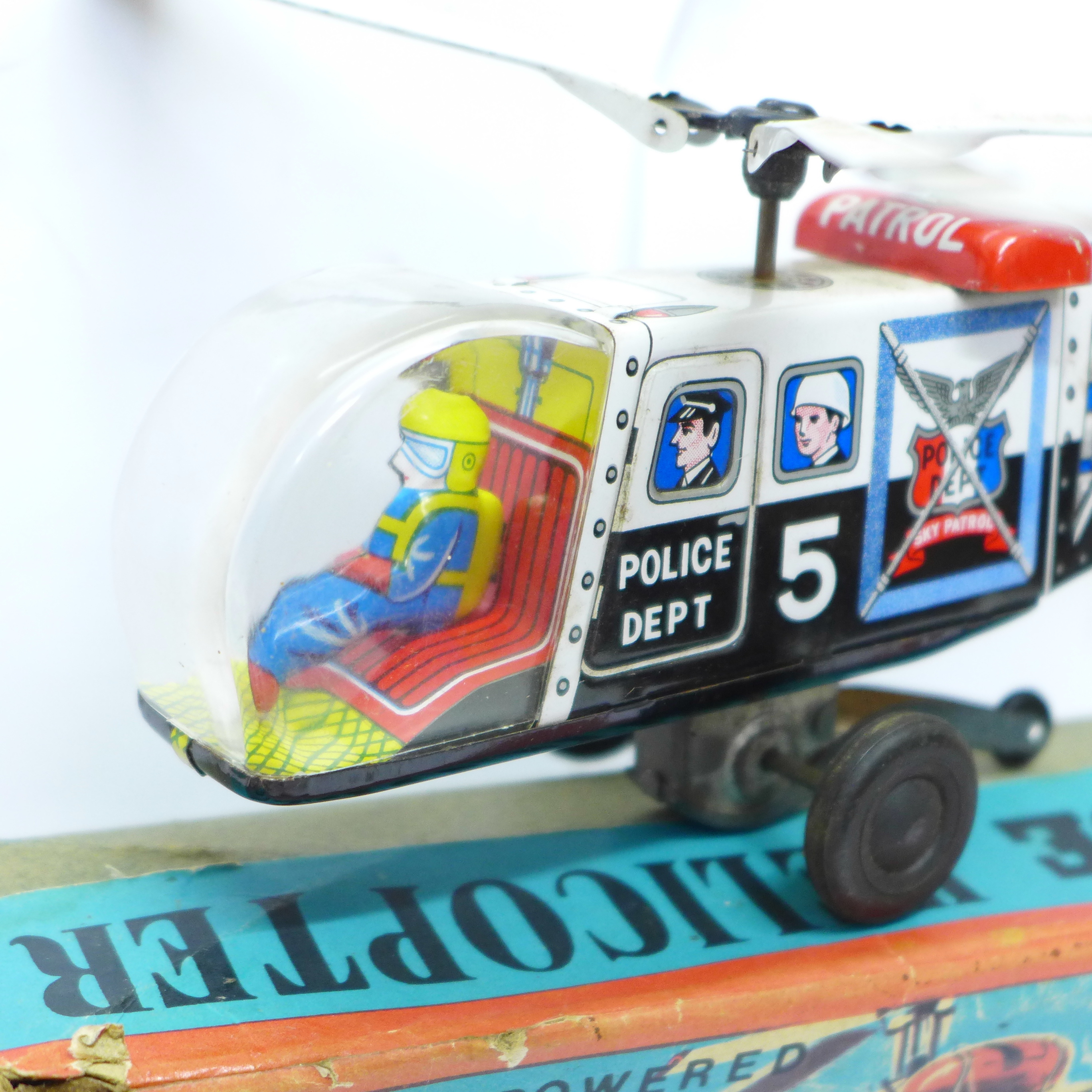 A Friction Powered tin-plate Police Helicopter, made in Japan, boxed, and a T.N. made in Japan tin- - Image 3 of 4