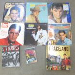 Eight Elvis Presley LP records, a Graceland pop-up tour book, one other book and DVD