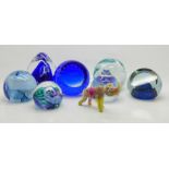A collection of glass paperweights including Caithness and a small glass rhinoceros