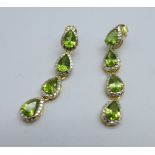 A pair of silver gilt and peridot drop earrings