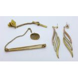 A 9ct gold and diamond stud with metal back fastener, a 9ct gold bar brooch and a pair of yellow