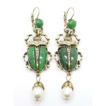 A pair of scarab beetle earrings