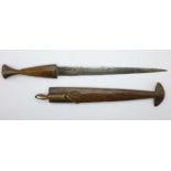 An African dagger with carved wooden handle and scabbard, 39cm with scabbard