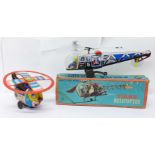 A Friction Powered tin-plate Police Helicopter, made in Japan, boxed, and a T.N. made in Japan tin-