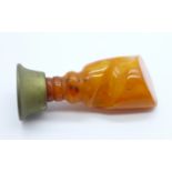 A seal with a carved amber handle, 66mm