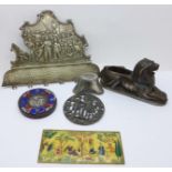 A painted faux ivory plaque, a metal lion pin cushion, Chinese weight, etc.