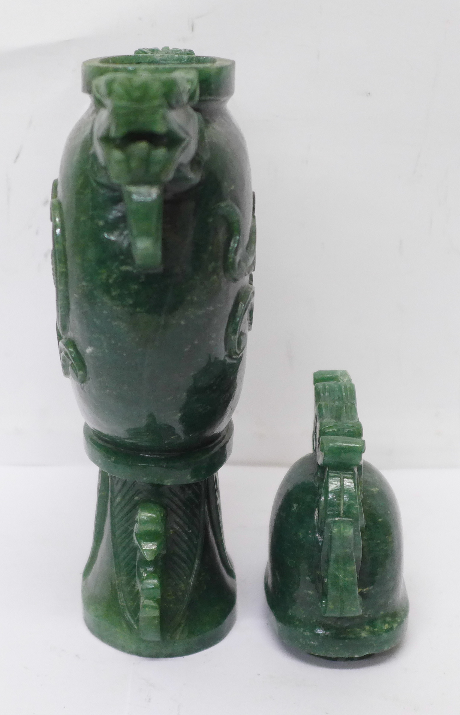 A carved green stone urn with lid, small losses to the lid and one ring missing, 23cm - Image 4 of 6