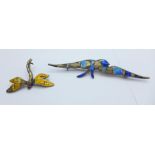 Two hallmarked silver and enamel brooches, bird brooch by Charles Horner, both a/f
