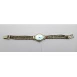 A silver wristwatch with mother of pearl dial