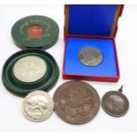 A Rhodes centenary crown, case a/f, a 1935 commemorative, two medallions and a badge