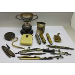 A plated trophy, matchbox holder, two whistles, pocket knives, etc.