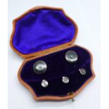 A cased set of yellow metal, onyx and seed pearl studs, 7.8g