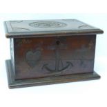 A wooden box with Faith, Hope and Charity carvings