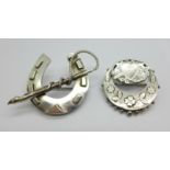 A hallmarked Victorian silver brooch and a large horseshoe brooch