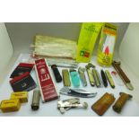 A cigar cutter marked Solingen, pipe knives and cleaners, lighters, Dunhill lighter flints, etc.