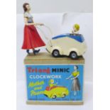 A Tri-ang Minic Clockwork Mother and Pram, boxed