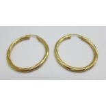 A pair of 9ct gold earrings. 2.4g, 33mm diameter