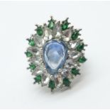 A large 'flower', blue, white and green dress ring, size L