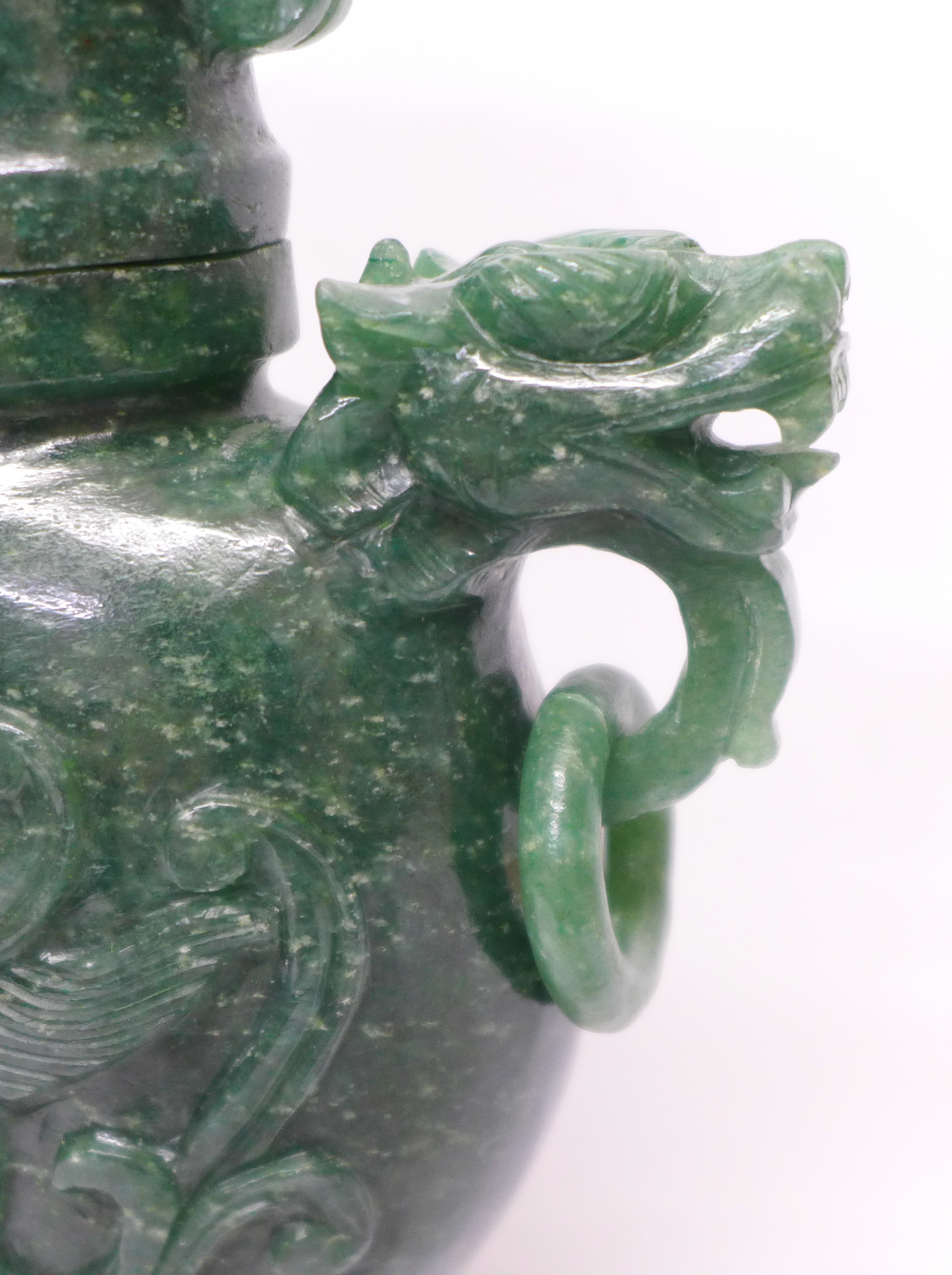 A carved green stone urn with lid, small losses to the lid and one ring missing, 23cm - Image 2 of 6