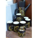 A Denby Arabesque six setting coffee service, lacking one cup