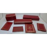 Three Cartier boxes and booklets, (two pen, one watch)