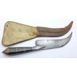 A Chilean Corvo knife with leather scabbard, scabbard a/f
