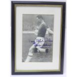 A framed photograph of Brian Clough playing for Middlesbrough, signed