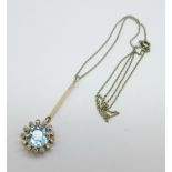 A white and yellow metal set, aquamarine and diamond cluster pendant on a platinum chain, tests as