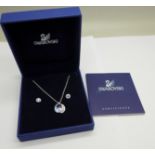 A Swarovski pendant and a pair of earrings, with gift box