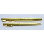 A gold plated Sheaffer fountain pen with 14ct gold nib and a matching propelling pencil