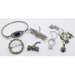 An 800 silver and stone set dragonfly brooch, one other dragonfly brooch, a silver bangle, two