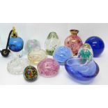 Eight glass paperweights and other glassware including a scent bottle, vase and a dish, etc.