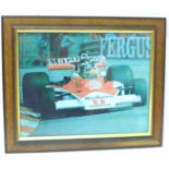 A framed photograph of James Hunt, signed