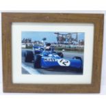 A framed photograph of Jackie Stewart, signed