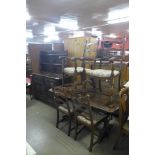 An Ercol Old Colonial dark elm dresser, refectory table and six ladderback chairs