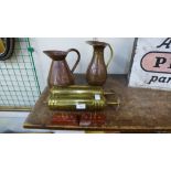 Two brass fire extinguishers and two copper jugs